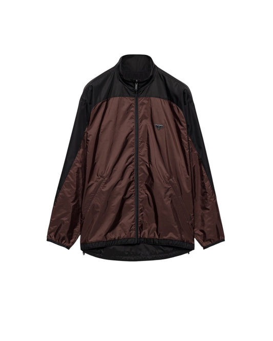 Veste réversible MAISON LUXURY en Re-Nylon marron cacao et noir avec col montant, fermeture zippée et logo triangulaire